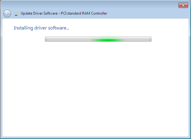 As the driver software installs, a flashing bar in the Update Driver Software wizard window shows the system is busy.
