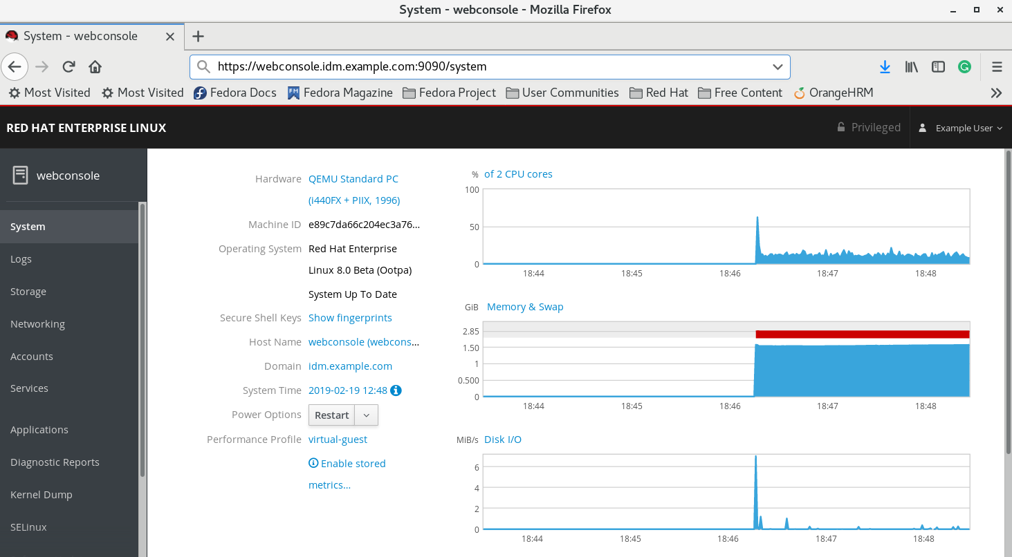 A screenshot of the web console with a menu in a column along the left that has the following buttons: System - Logs - Storage - Networking - Accounts - Services - Applications - Diagnostic Reports - Kernel Dump - SELinux. The "System" option has been chosen and displays details for the system such as Hardware - Machine ID - Operating system - Secure Shell Keys - Hostname - and others. 3 graphs display usage of CPUs over time - use of Memory and Swap over time - and Disk I/O over time.